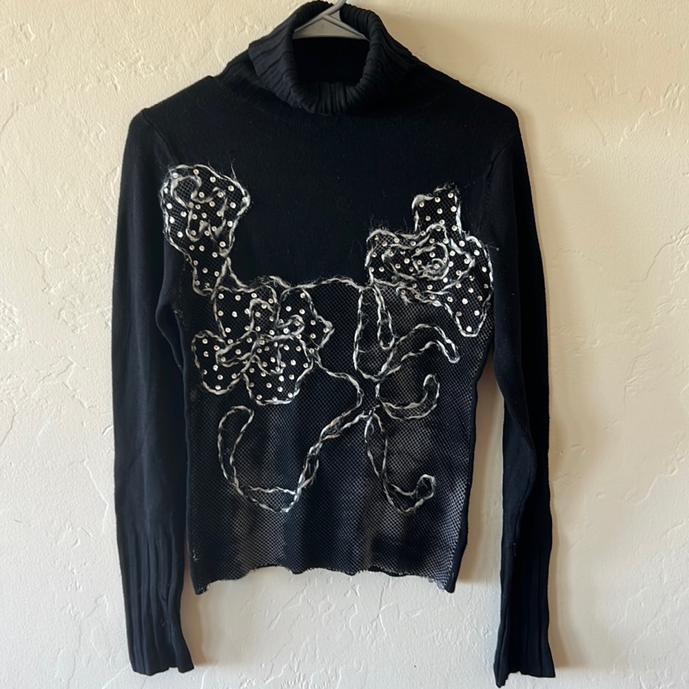 Embellished black turtleneck